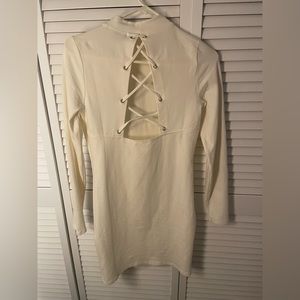 Brand new white long sleeve, open back dress